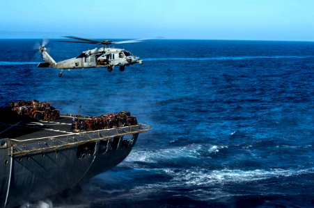 HSC-21 MH-60S Sea Hawk helihoisting supplies from USNS Henry J. Kaiser (T-AO-187) during vertical replenishment of USS Anchorage (LPD-23) during Essex ARG COMTUEX (150325-N-BD107-267)