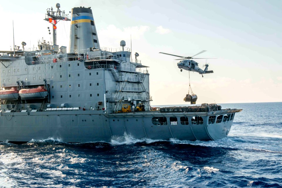 HSC-14 MH-60S Sea Hawk helihoisting cargo from USNS Tippecanoe (T-AO-199) during replenishment-at-sea with USS John C. Stennis (CVN-74) 160506-N-SF251-005