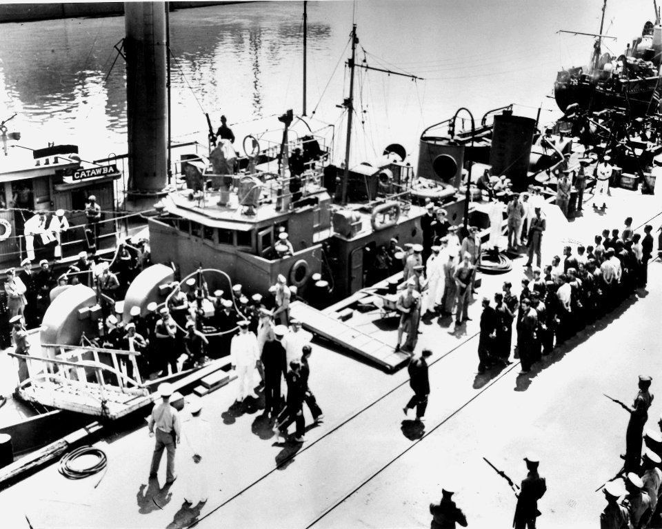 Icarus disembarking surviving U-352 crew members at the Charleston Navy Yard in Charleston, South Carolina