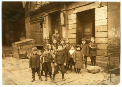 In an alley back of a moving picture theatre on First Street. Children were hanging about the 'stage' entrance-'peeking in.' Photo taken at 10-30 P.M. Little tot on right said was 5 years LOC nclc.04622