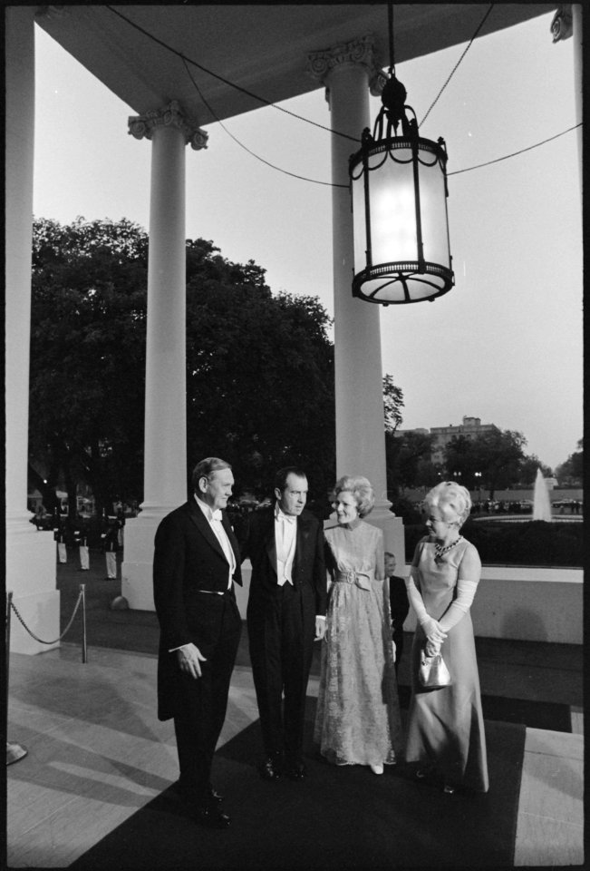 In evening clothes, the President and Mrs. Nixon greet Australian Prime Minister Gorton and Mrs. Gorton at the north... - NARA - 194627