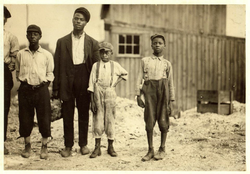 In the Alexandria glass factories, negroes work side by side with the white workers. Also in Richmond. These are some of those working in Alexandria (Va.) Glass Factory. LOC nclc.01299