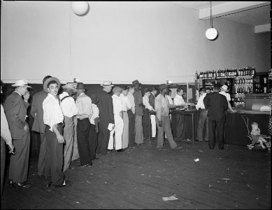 In the liquor store on Saturday afternoon. Welch, McDowell County, West Virginia. - NARA - 541005