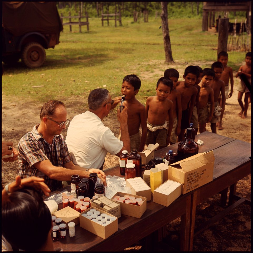 In a remote Thai village school children are examined by members of a U.S. Air Force Civic Action Center team from... - NARA - 542332