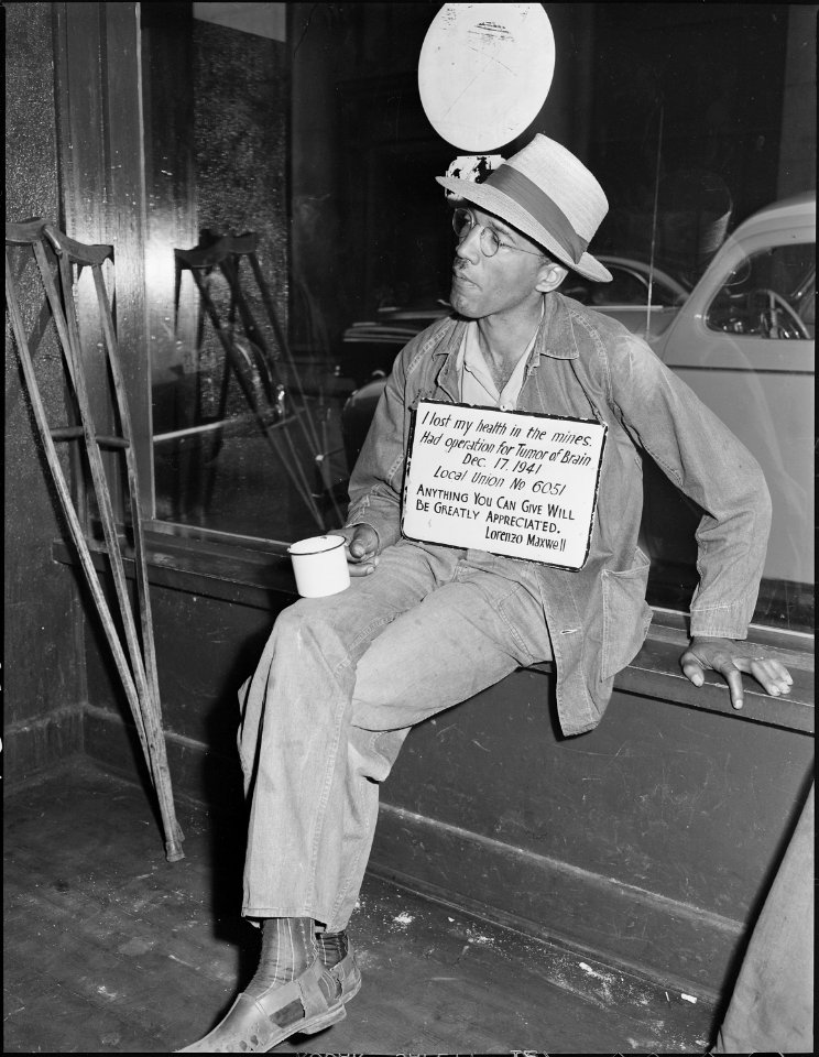 In the liquor store on Saturday afternoon. (Disabled miner.) Welch, McDowell County, West Virginia. - NARA - 541013