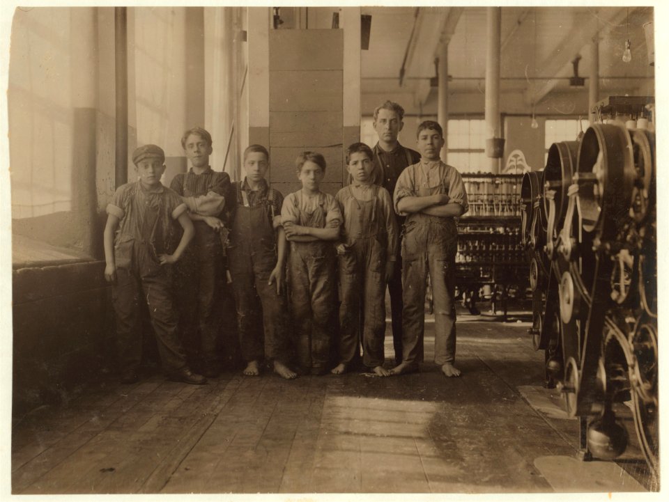 In this group are some of the youngest workers in Spinning Room of Cornell Mill. The smallest is Jo Benevidos, 5 Merion St. Other small ones are- John Sousa, 84 Boutwell St., Anthony LOC nclc.02505