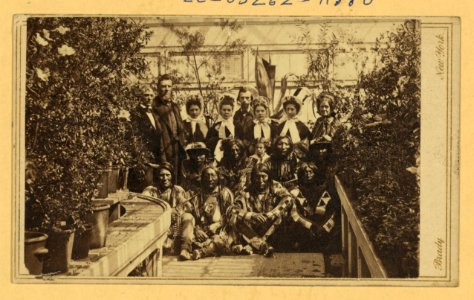 Indian delegation in the White House Conservatory during the Civil War, with J.G. Nicolay, President Abraham Lincoln's secretary, standing in center back row and interpreter John Simpson LCCN2004669812