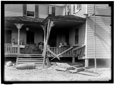 INDIAN HEAD, MD. NAVY PROVING GROUND. RESIDENCE OF GEORGE SWANN, DAMAGED BY 16' SHELL THAT HIT ANOTHER IN SANDBANK, AND WAS DEFLECTED OVER COUNTRY AT 3-4 ANGLE. THE SHELL, WHERE IT STOPPED LCCN2016864360