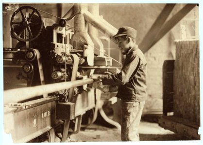 Indiana Mfg. Co., Boy taking boards away from 'double cut-off' machine. A Suggestive Name!. LOC cph.3a20820
