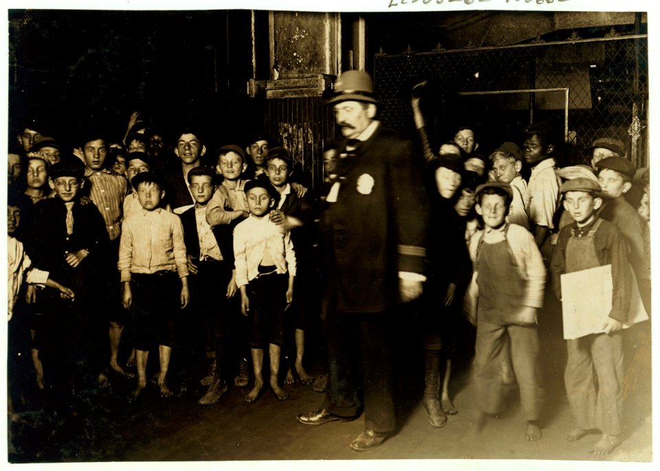 Indianapolis Newsboys Waiting for the Base-ball Edition In a Newspaper Office. Aug., 1908. Wit., E. N. Clopper. LOC cph.3c05662