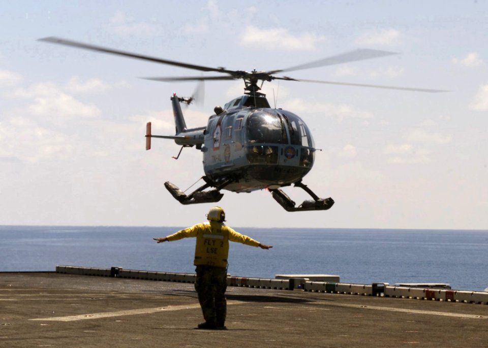 Indonesian Navy Bo 105 lands on USS Inchon (MCS-12) 2001