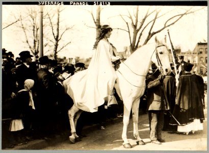 Inez Milholland Boissevain, wearing white cape, seated on white horse at the National American Woman Suffrage Association parade, March 3, 1913, Washington, D.C. LCCN97510669