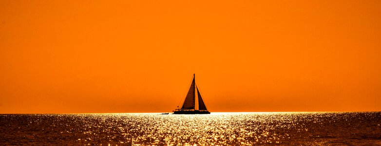 Catamaran orange sea photo