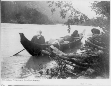 Indians (2 women and child) freighting up Dyea River in canoe. (Alaska) LCCN2007678272 photo