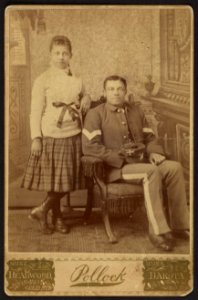 Infantry sergeant, Buffalo soldier, with young girl) - Pollock, Main & Gold Sts., Deadwood, Dakota LCCN2010645134