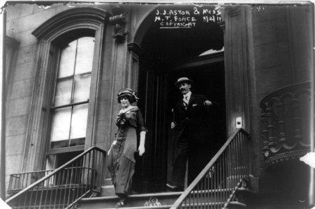 J.J. Astor and Miss M.T. Force walking down steps outside building LCCN96512736