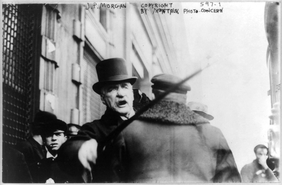 J.P. Morgan striking photographer with cane LCCN99400614