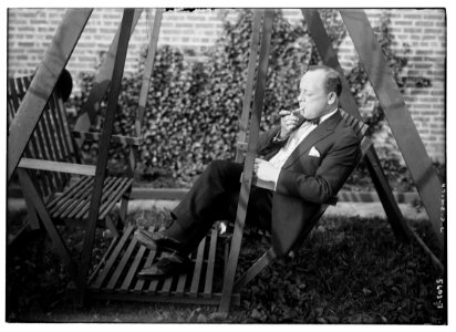 J.C. Smith (sitting outdoors, smoking) LCCN2014713607 photo