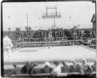 Jack Dempsey at his training camp, June 1921- jumping rope in ring before crowd LCCN2005681071
