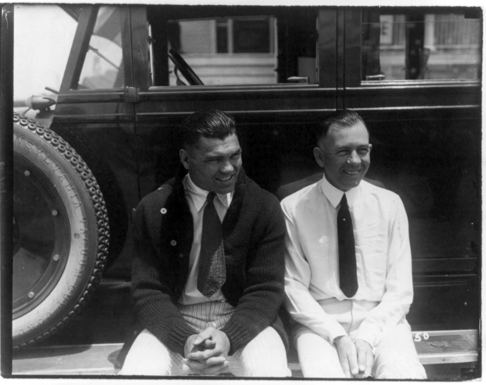 Jack Dempsey at his training camp, June 1921- seated with man on auto running board LCCN2005681066