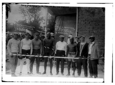 Jack Johnson & trainer in camp- Marty Cutle, W. Burns, C. Respress, Jack Skully, J. DeBray, Perkins LCCN2014692189