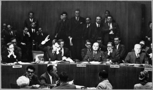 Jacob A. Malik, representative on the Soviet Union on the United Nations Security Council, raises his hand to cast... - NARA - 541950 photo