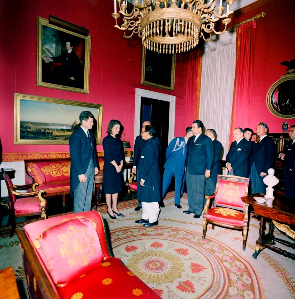 Jacqueline Kennedy with Ambassador of Pakistan, Ghulam Ahmed, at reception following funeral of President John F. Kennedy