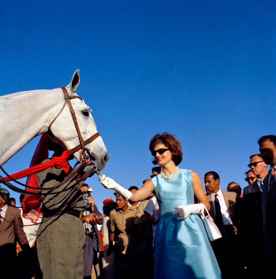 Jacqueline Kennedy feeds a horse in India