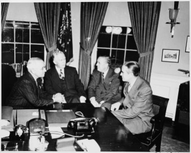L to R, President Truman, George Marshall, Paul Hoffman, and Averell Harriman, in the oval office discussing the... - NARA - 200036 photo