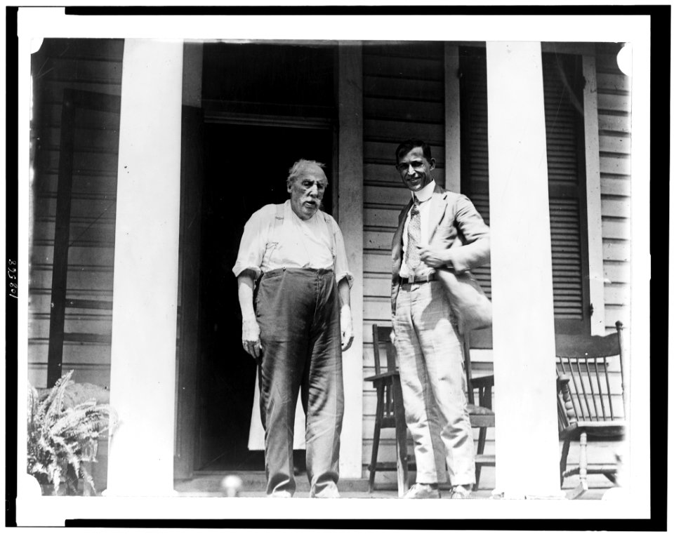 L.D. Anderson, of Anacostia, 95 years old, oldest member of Metropolitan Police, full-length, standing on porch, with another man, facing slightly right LCCN93513633