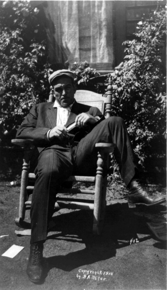 James J. Jeffries, full-length portrait, seated outdoors in rocking chair, facing front LCCN96513960