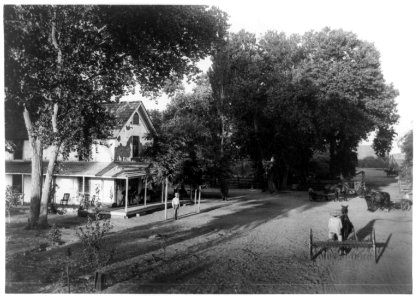 James Ranch, showing the superintendent's home and horse-drawn farm machinery in front of house, Kern County, Calif. LCCN93514449
