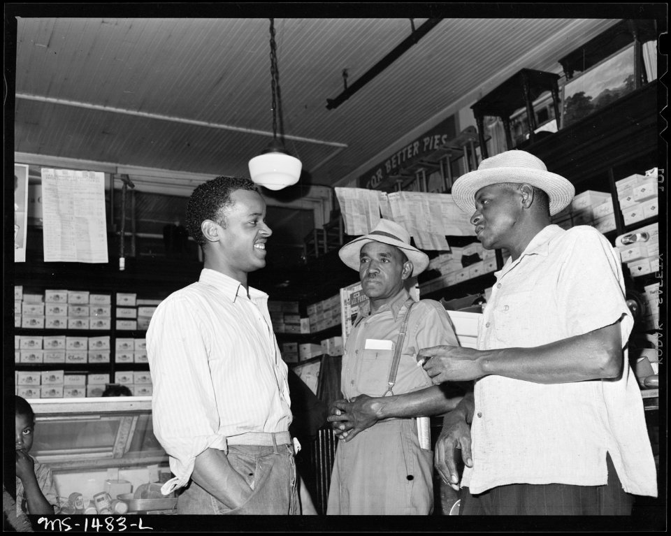 James Robert Howard, left, visits with fellow-miners in the company store. Gilliam Coal and Coke Company, Gilliam... - NARA - 540813