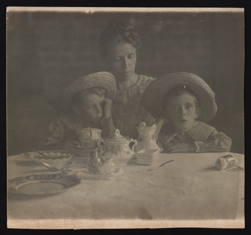 Jane White with sons Lewis and Maynard White seated at dining table with teacups LOC ds.10666