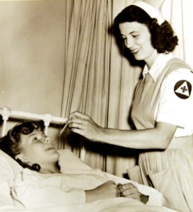 Jane Womach, nurse’s aide, takes temperature of Audrey Welch at Georgetown University Hospital, Washington, D.C. (35055544175)