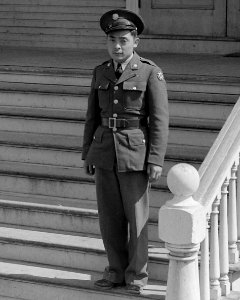 Japanese American soldier on Buddhist church steps, 12 May, 1942 - Florin, California. This soldier, age 23, volunteered - NARA - 537850 (cropped)