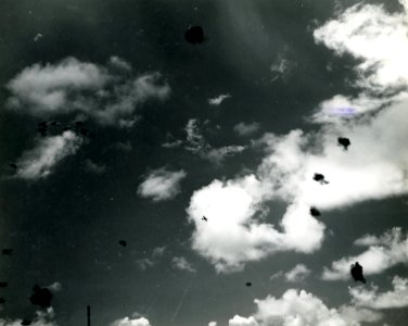 Japanese Aichi D3A flies over USS South Dakota (BB-57) during the Battle of the Santa Cruz Islands, 26 October 1942 (80-G-33355)