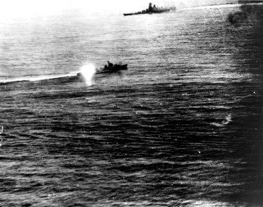 Japanese battleship Yamato and a destroyer in action with U.S. Navy carrier planes north of Okinawa on 7 April 1945 (80-G-313714)