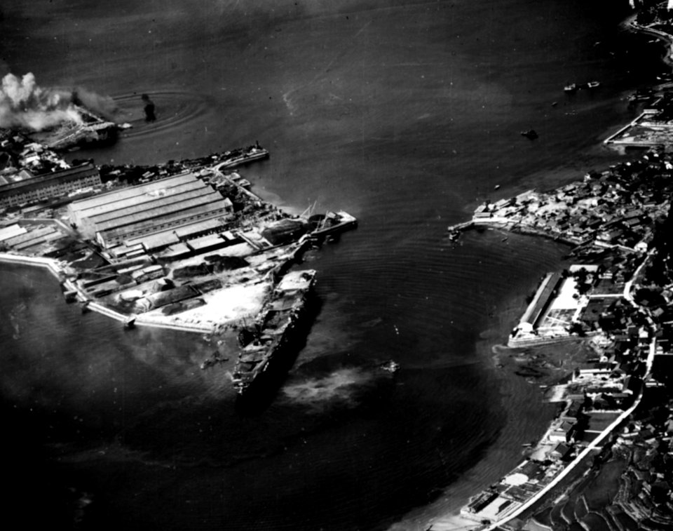 Japanese aircraft carrier Katsuragi under attack at Kure, Japan, on 28 July 1945 (80-G-344680)