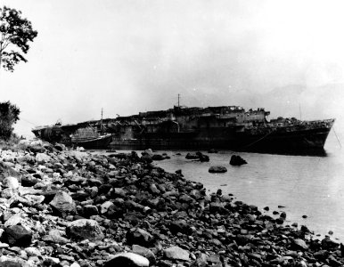 Japanese escort carrier Kaiyō beached in Beppu Bay, Japan, while being scrapped, circa in 1946-1947 (NH 85386)