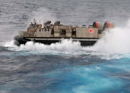 Japanese Maritime Self-Defense Force Landing Craft, Air Cushioned (LCAC) 2104 returns to her ship photo