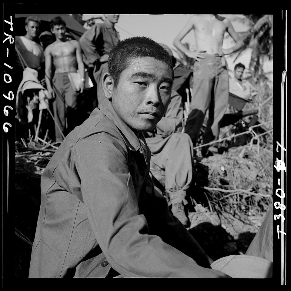 Japanese prisoner awaits questioning by intelligence officer on Guam. - NARA - 520971