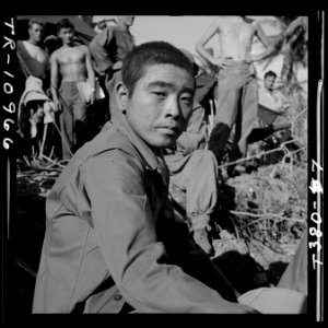 Japanese prisoner awaits questioning by intelligence officer on Guam. - NARA - 520971