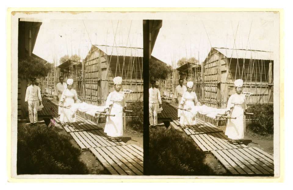 Japanese nurses carrying a patient on a stretcher LCCN2005678648