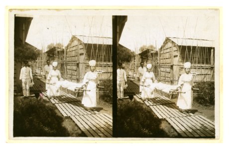 Japanese nurses carrying a patient on a stretcher LCCN2005678648