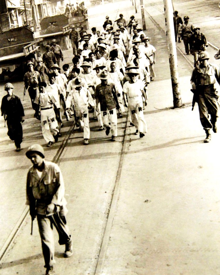 Japanese prisoners of war under direction of military police, Philippine Islands, WWII (34430148196)