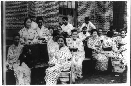 Japanese women and men sitting on benches, Hawaii LCCN2016648993