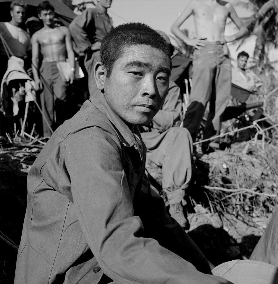 Japanese prisoner awaits questioning by intelligence officer on Guam. - NARA - 520971 (cropped)