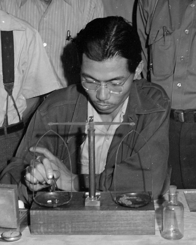 Japanese American using pharmacy balance on 28 June 1942, Manzanar Relocation Center, Manzanar, California. Chemists, nurserymen, and plant propagators at th . . . - NARA - 538037 (cropped) (cropped)