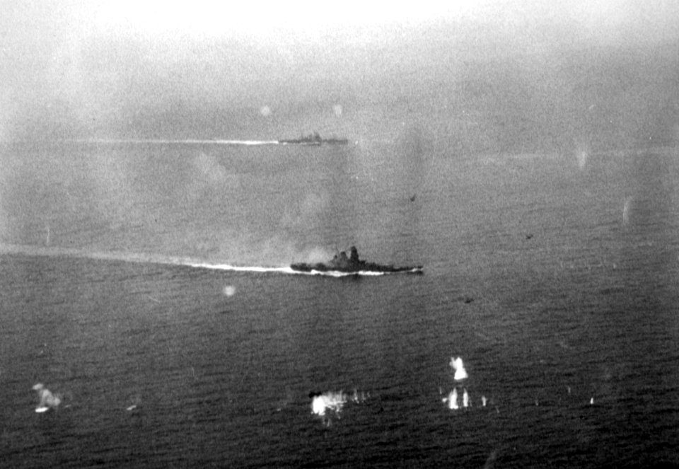 Japanese battleship Yamato and a heavy cruiser underway during the Battle off Samar, 25 October 1944 (80-G-378525)